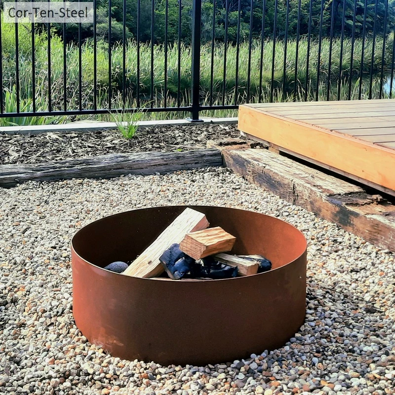 corten fire pit ring in a backyard