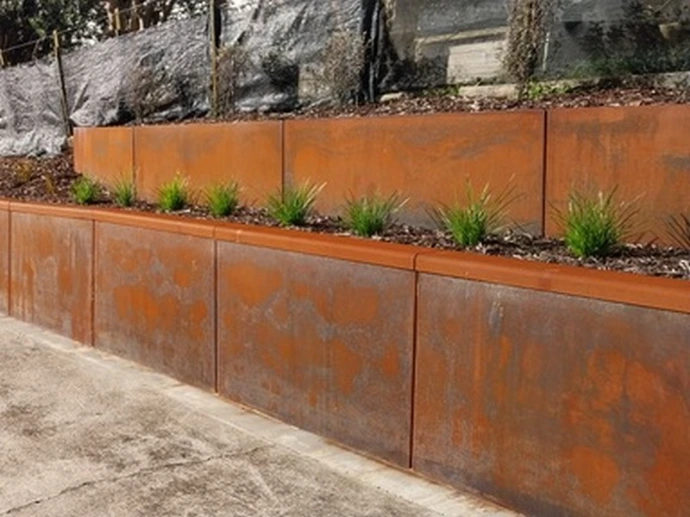 terraced corten retaining wall on a slope
