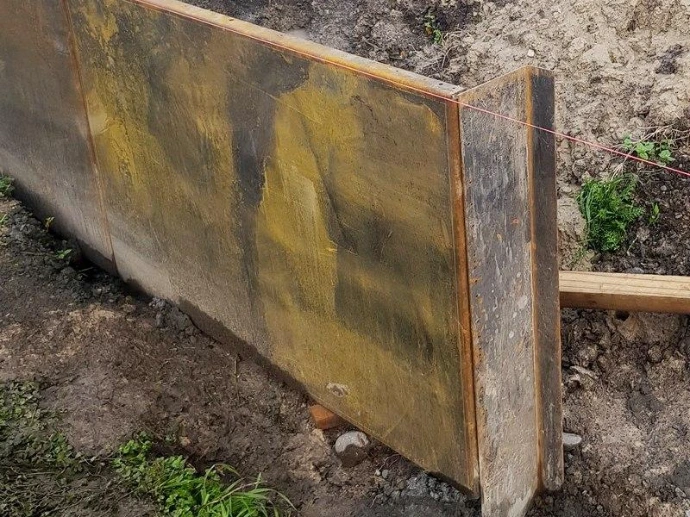 A slim wall to reclaim yard space.